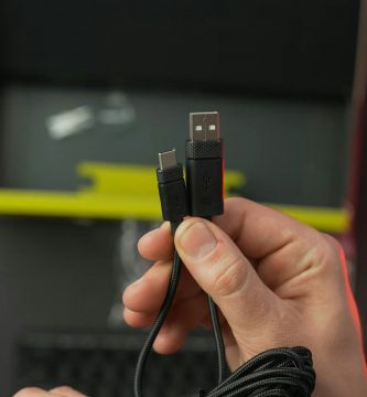 a person holding a usb device in their hand